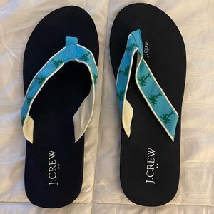 JCREW palm tree navy blue flip flops. Brand new never worn, size 9.